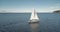 Slow motion sail boat reflection at sea bay. Sailboat at ocean gulf. Cruise race of passenger yacht