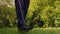 Slow motion search for coins with a metal detector on the site of a country house. A man is looking for treasures in his garden