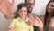 Slow Motion Shot Of Family Standing Against Wall And Waving