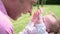 Slow Motion Shot Of Father Holding Baby Daughter In Garden