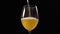 Slow motion shot of golden foamy beer, beer is poured to the glass, beer glass in dark background, bubbles in beer