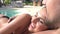 Slow Motion Shot Of Young Couple Relaxing By Swimming Pool