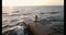 Slow motion shot of young woman standing on stone pier