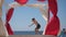 slow motion of somersault of little kid on beach during summer leisure vacation activity