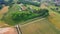 Slow motion stabilized shot - Famous cypress trees row along Tuscany road by POV of car driver driving along countryside