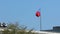 Slow motion taiwanese flag waving in wind at Taipei internatinal airport.