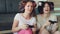 Slow motion of two funny women play console games with gamepad and have fun at home