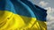 Slow motion of Ukrainian flag wind waving against the sky