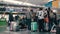 Slow Motion Unrecognized Family tourist grandmother with her teenage grandson, waiting in line for check-in at the