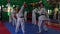 Slow motion video of adult taekwondo training session in the gym, coach explaining a new kick
