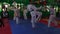 Slow motion video of adult taekwondo training session in the gym, coach explaining a new kick