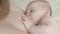 Slow motion video of baby breastfeeding