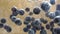 Slow motion video of blueberries sink to water