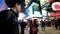 Slow motion video of people moving at crossroad in crowded evening city street. Hong Kong