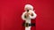Slow Motion video Portrait Happy Santa Claus Trying to Blow Firecracker or Opening Popper in Red Background. Santa Claus