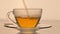Slow-motion video, pouring the hot tea into a clear glass