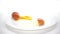 Slow motion video of raw egg breaking down in a white plate