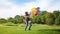 Slow motion video of young man lifting and spinning his girlfriend holding colorful balloons