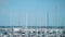 Slow motion view of Barcelona marina from window of moving train.