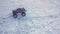 Slow motion. View of radio controlled model car on outdoor racing track in winter. Free time. Children and adults concept.