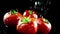 Slow motion of water splash on red tomato on black background, concept of healthy food