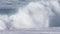 Slow motion waves close up crashing along shoreline in Northern California at Big Sur Monterey area during tide