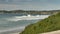 Slow motion waves crashing along shoreline in Northern California at Carmel by the Sea area during tide