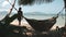 Slow motion woman going beach on El Nido island, Philippines, Asia. Traditional boat on ocean water