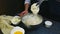 Slow motion of woman holds in hand metal whisk with leftovers of soft dough