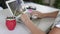 Slow Motion. Woman working on laptop and drinking yerba mate tea in home office