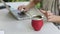 Slow Motion. Woman working on laptop and drinking yerba mate tea in home office