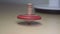 Slow motion wooden spinning top in action