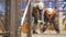 Slow Motion Workers Fix with Drills Metal Racks in Warehouse