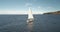 Slow motion of yacht reflection at sea gulf aerial. Sail boat reflect at ocean bay. Racing sailboat