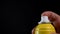 Slow Motion Of Yellow Spray Bottle Drops On Black Background