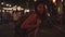 Slow motion - Young Asian traveling women backpacker drinking alcohol or beer and dancing in urban street night party.