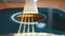 Slow movement of the vibrating string on acoustic guitar. Slow motion