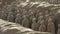 Slow pan across Terracotta Army warriors buried in Emperor tomb outside Xian China