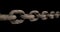 Slow panning across a rusty chain showing each link pulled taut. Concept of strength, security, or strong connection