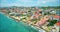 Slow revealing aerial of colorful housing district of Pietermaai in Punda, Curacao