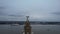 Slow rising shot of the Liver Bird looking out at the ferry on the River Mersey