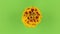 Slow rotation of a yellow flower on a green background, keying.