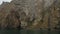 Slow shot boat ride along the foot of the ancient Karadag volcano