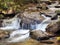 Slow Shutter Speed Image of a Waterfall in a Rocky Georgia Stream in the Fall of the Year