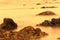 Slow shutter speed photographing water surrounding rock formation in Namibia