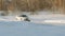 SLOW: Sport car turns on a winter ice road