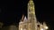 Slow tilt shot up the main spire of Matthias Church, Fisherman`s Bastion, Budapest, Hungary illuminated at night