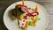 Slow zoom in at exclusively decorated modern restaurant meat dish with vegetables