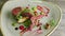 Slow zoom in at half-eaten exquisite semi-raw meat restaurant dish