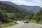 Slowing down car on mountain serpantine road.